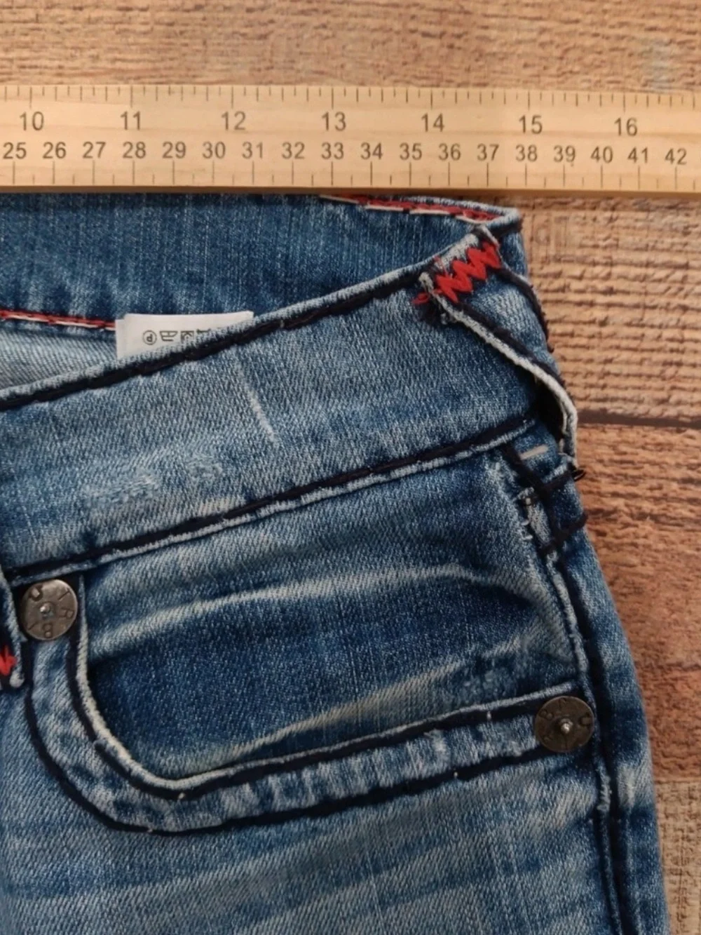 True Religion light blue jeans with red contrast stitching